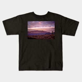 Hilly countryside at sunset Kids T-Shirt